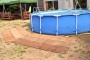 Wooden mat under the swimming pool tent camping